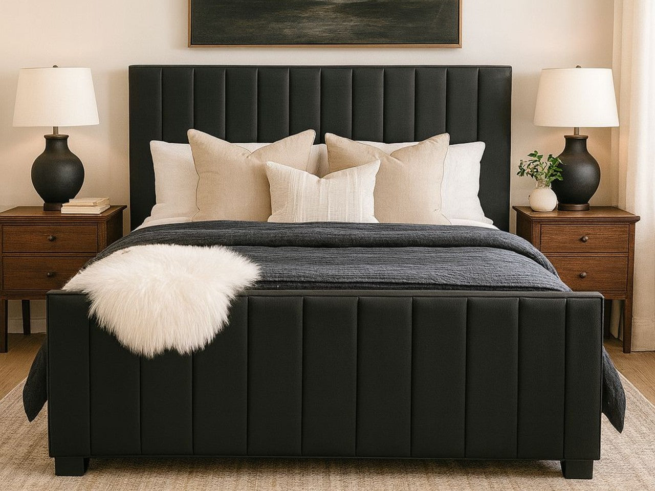 Black Brit bed in Calgary from Showhome Furniture with white pillows and a gray blanket in a bedroom setting.