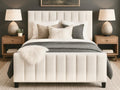 White Brit bed in Calgary from Showhome Furniture with decorative pillows and bedding