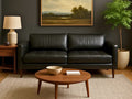 Modern living room with 3795 Custom leather sofa in Calgary, wooden coffee table, and decorative elements.