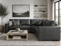 Gray leather sectional with deep seating and contemporary design.