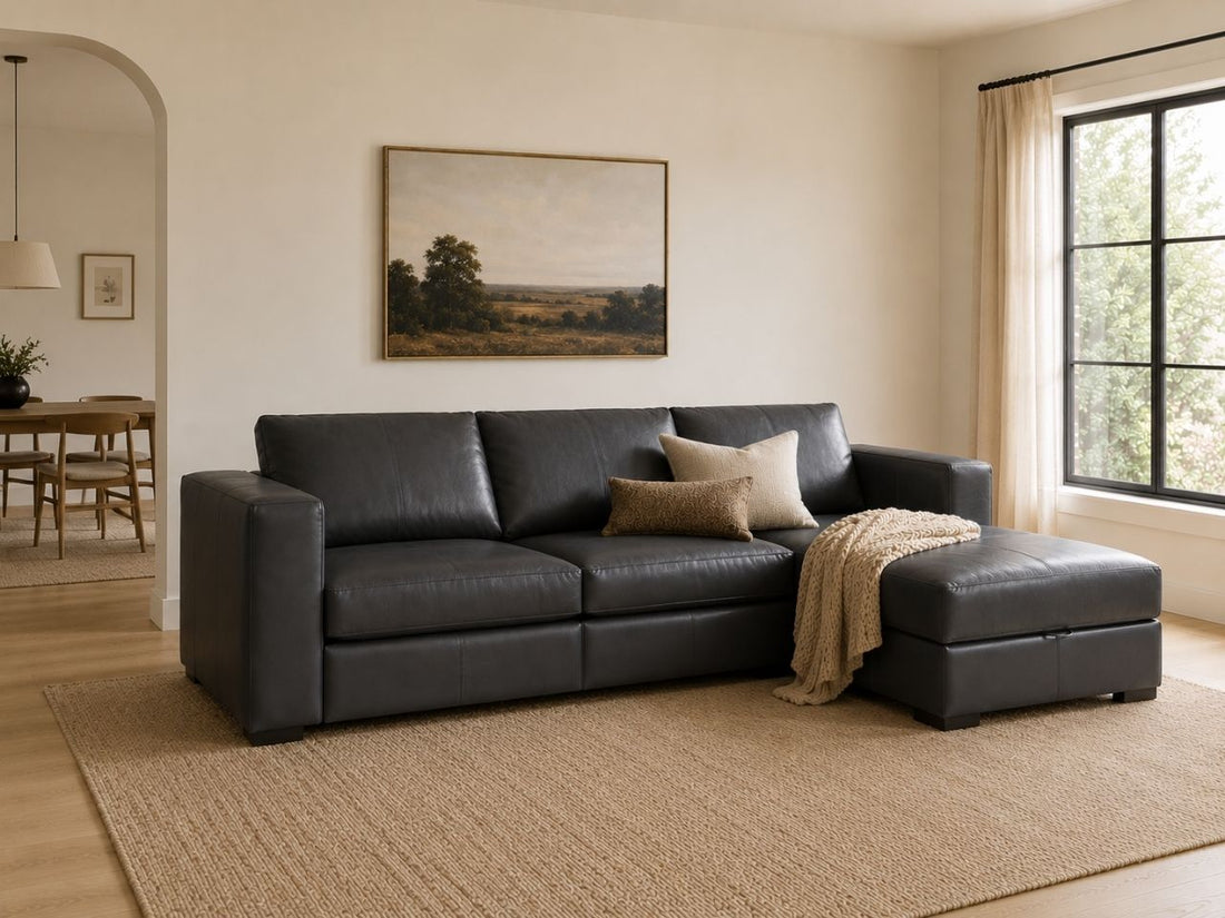 Dark leather sectional sofa with chaise in a warm, modern living room.