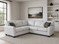 White leather sectional with plush seating and modern style.