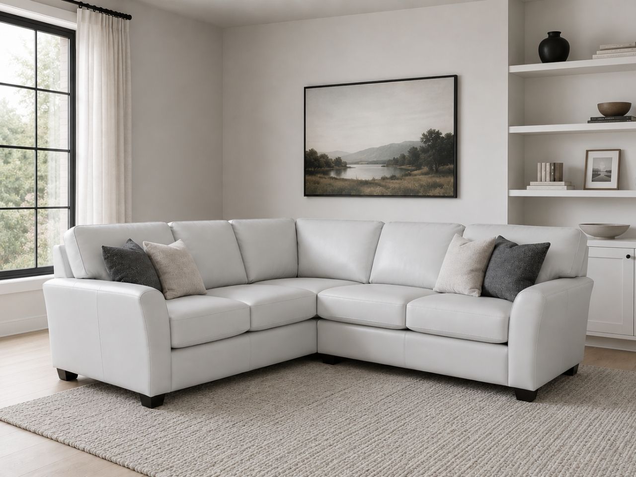White leather sectional with plush seating and modern style.