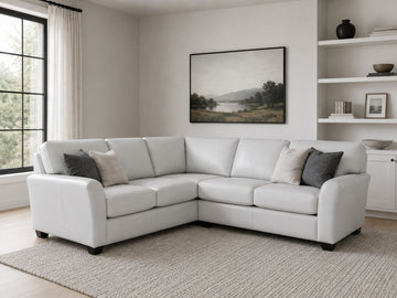 White leather sectional with plush seating and modern style.