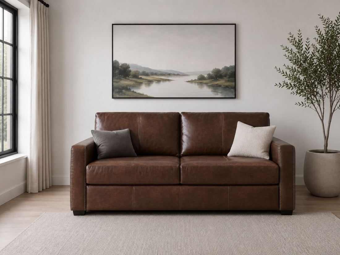 Brown leather sleeper sofa with clean modern lines.