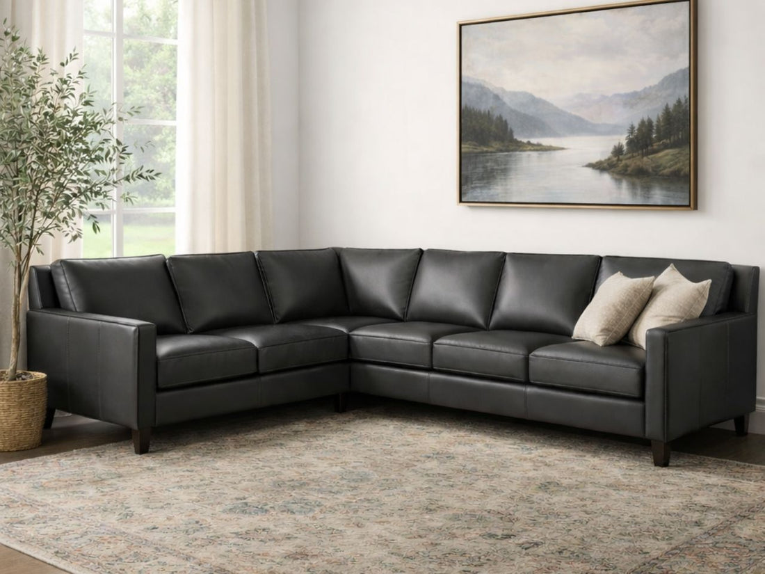 A large, L-shaped corner sectional in a warm cognac leather finish. 
