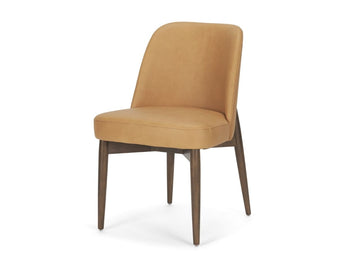 Tan upholstered dining chair with wooden legs on a white background.