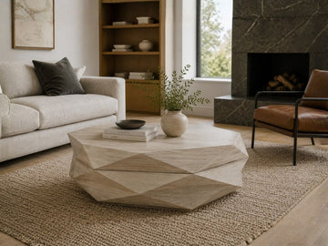 Geometric light wood coffee table with a faceted design styled in a modern living room.