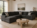 Dark gray sectional sofa with chaise in a cozy modern living room.