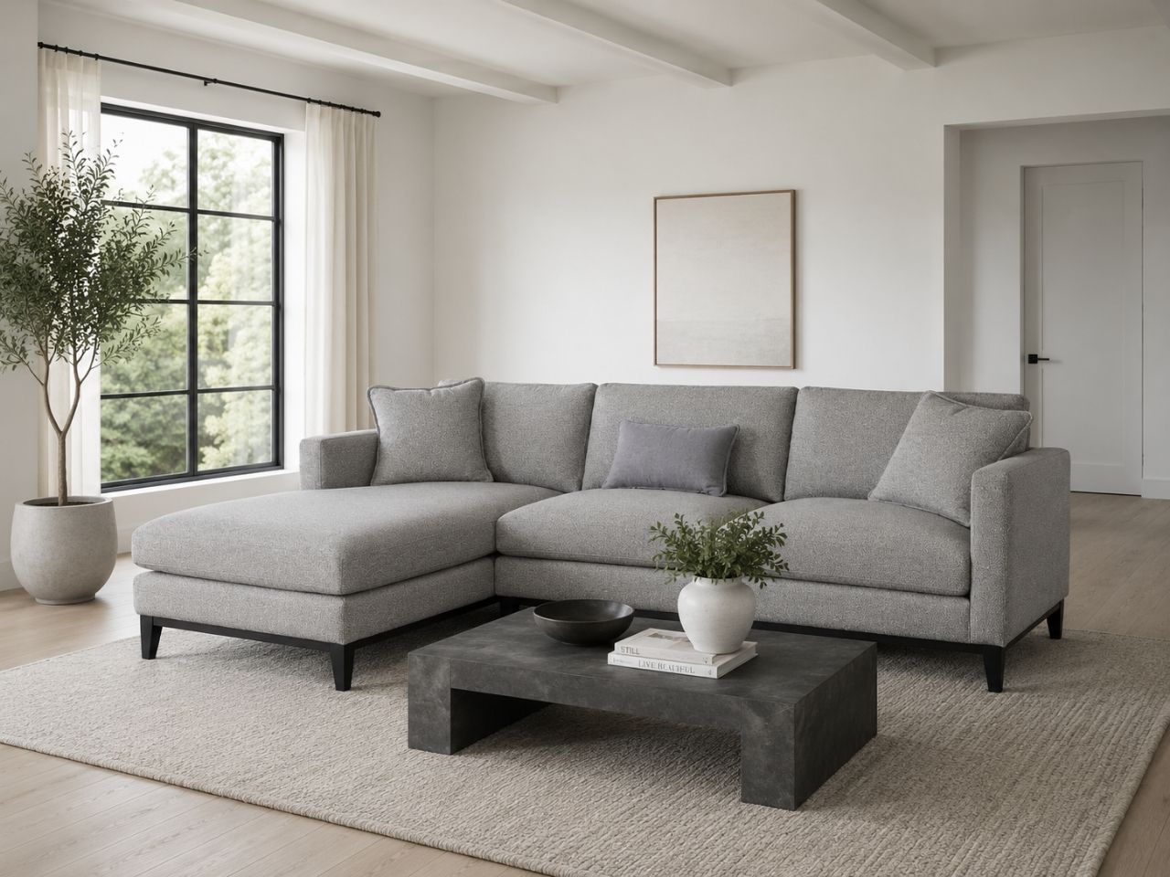 Gray chaise sectional sofa in a clean modern living room.