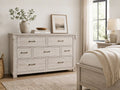 Light wood dresser with seven drawers and clean modern farmhouse design.