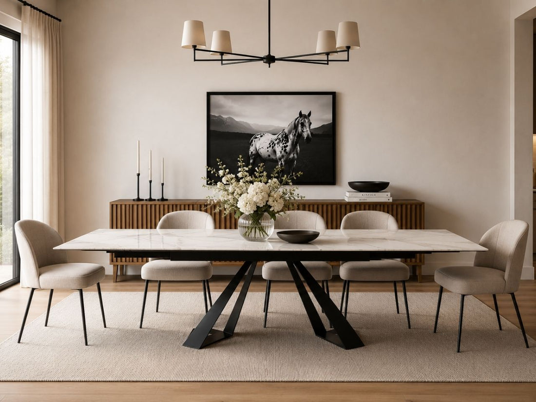 White dining table with six upholstered chairs and a black metal base.