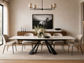 White dining table with six upholstered chairs and a black metal base.