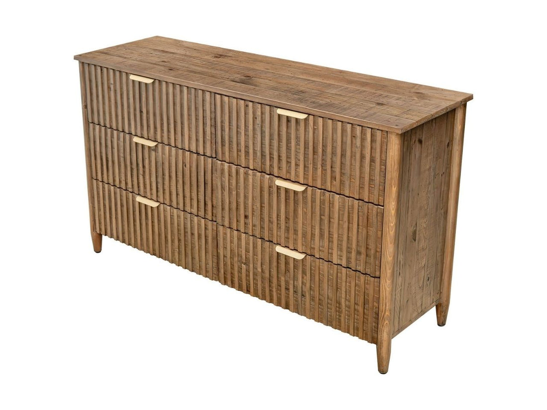 Solid wood six-drawer dresser with fluted fronts, styled beneath a round wall mirror.