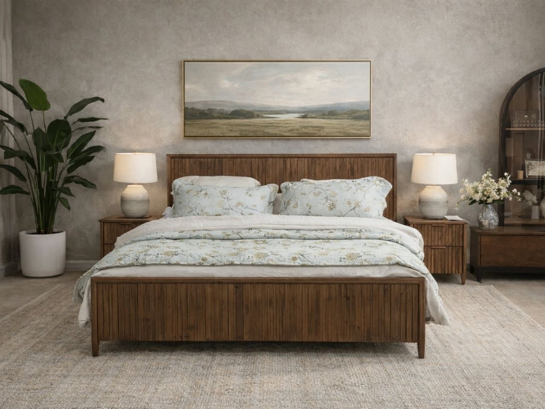 Solid wood fluted bed styled in a bright bedroom with neutral bedding and matching nightstand.