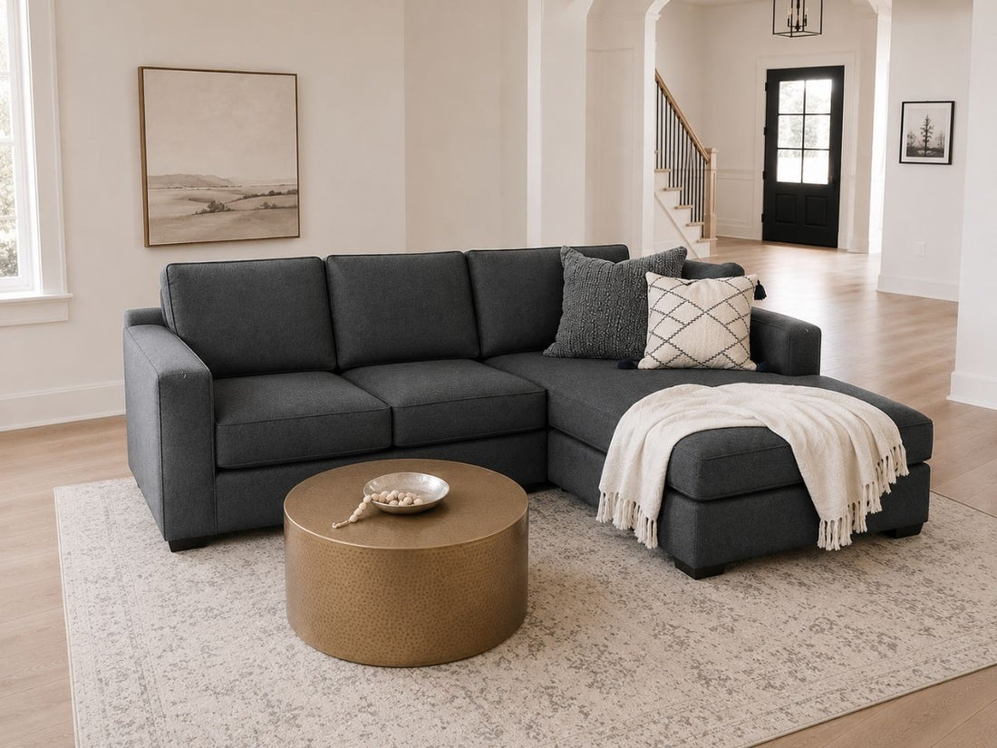 Dark gray sectional with chaise in a modern living room.