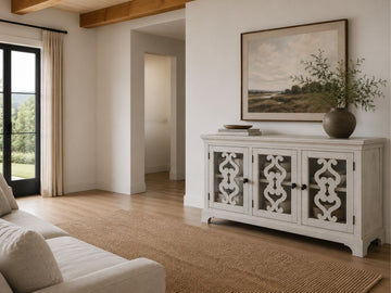Refined whitewashed server featuring decorative fretwork glass doors and classic transitional styling.