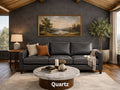 Three-cushion dark gray leather sofa labeled 