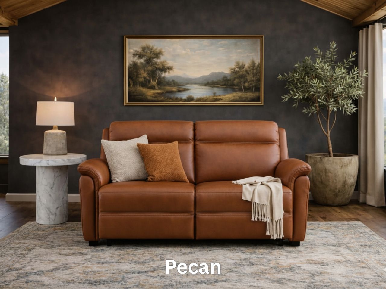 A warm, honey-toned leather sofa styled with earth-toned pillows and a light throw blanket.