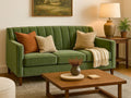 Custom Chanel sofa with decorative pillows and a wooden coffee table in a living room setting.