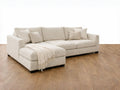 Clean-lined sectional featuring plush cushions and a chaise, crafted in durable fabric. 