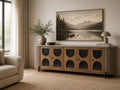 Modern sideboard with arched glass doors and fluted sides.