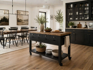 Brown wood rolling kitchen island with drawers and open storage.