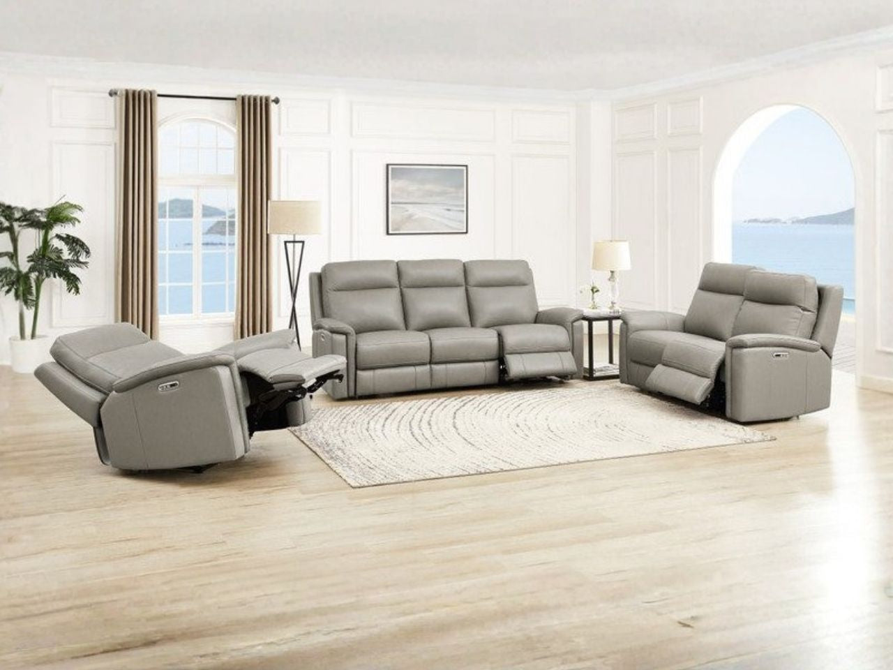 Gray zero gravity reclining seating set in a bright living room