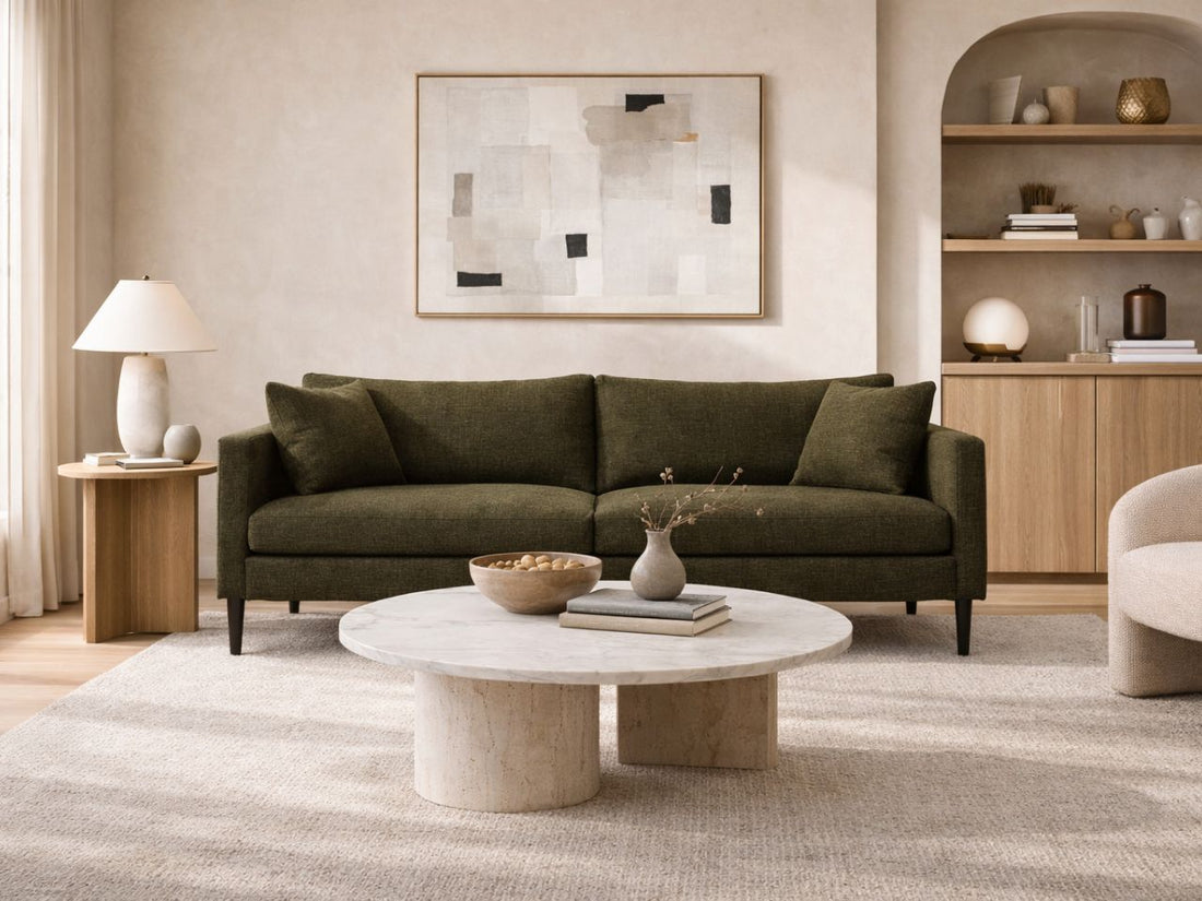 Modern living room with beige sofa, wooden coffee table, and decorative elements.