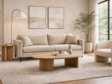 Modern living room with beige sofa, wooden coffee table, and decorative elements.