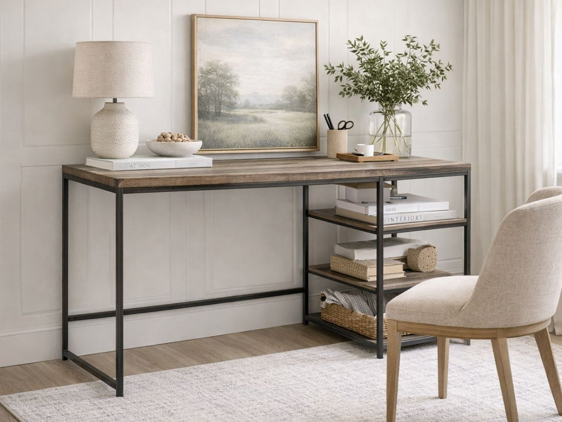 The Dandhi Multi-level Desk features a minimalist industrial design. It is constructed with a thick, rectangular tabletop made of textured wood with a weathered, multi-tonal brown finish.