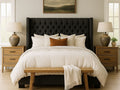 Neatly made darrk Panama bed in Calgary with white bedding and a wooden bench in a bedroom setting.