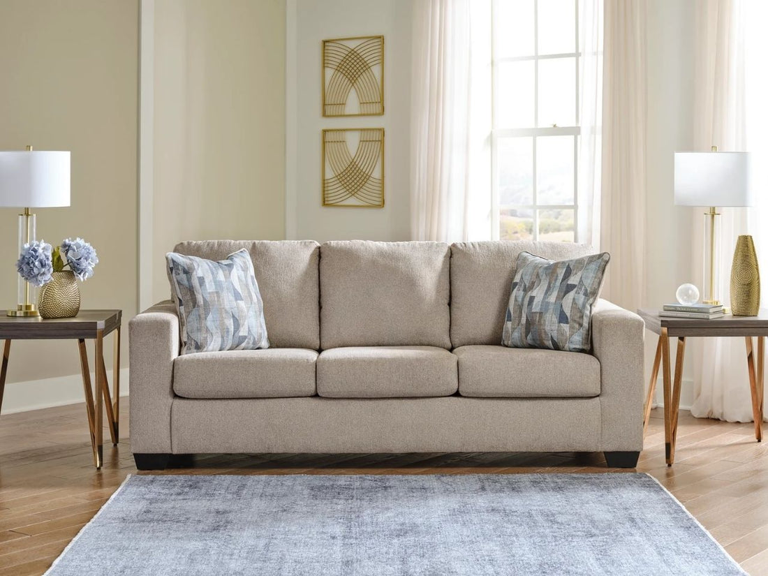 Beige sofa in Calgary with decorative pillows and side tables.