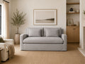 Gray loveseat in a cozy modern living room.