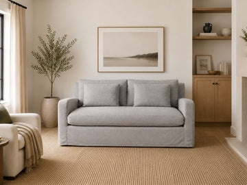 Gray loveseat in a cozy modern living room.