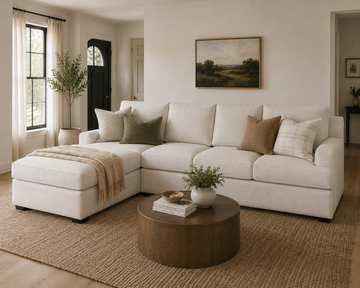 Cream sectional sofa with chaise in a warm modern living room.