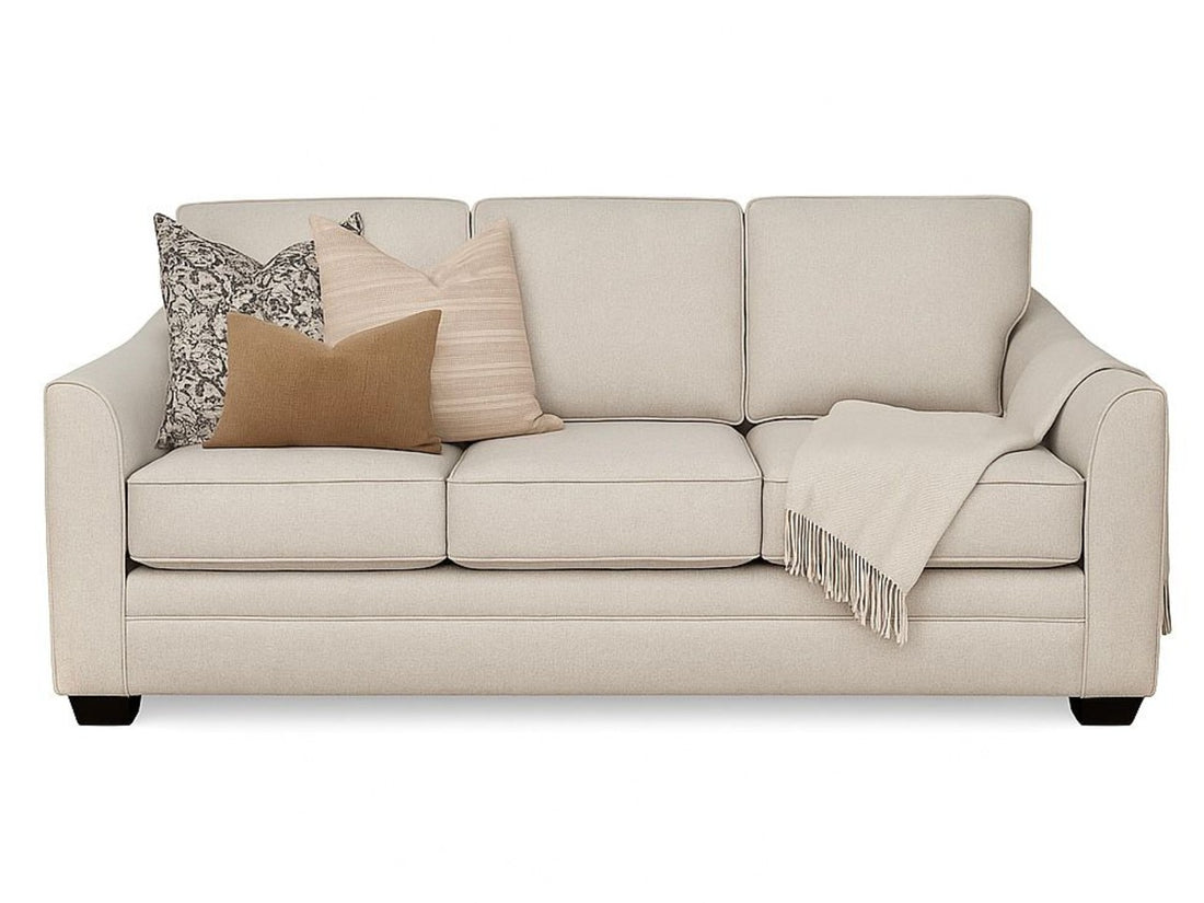 Modern living room with beige Denver sofa, armchairs, and a wooden coffee table by Showhome Furniture