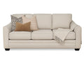 Beige Denver sofa with decorative pillows and a blanket by Showhome Furniture