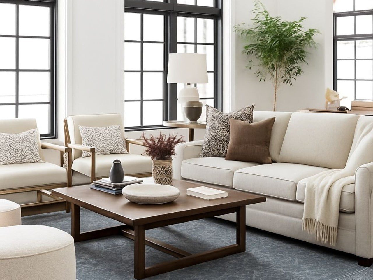 Modern living room with beige Denver sofa, armchairs, and a wooden coffee table by Showhome Furniture