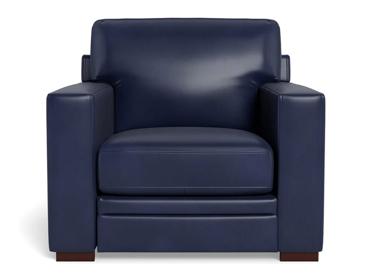 A modern leather accent chair with a boxy silhouette, wide arms, and a plush seat cushion, upholstered in deep navy blue leather and shown against a white background.
