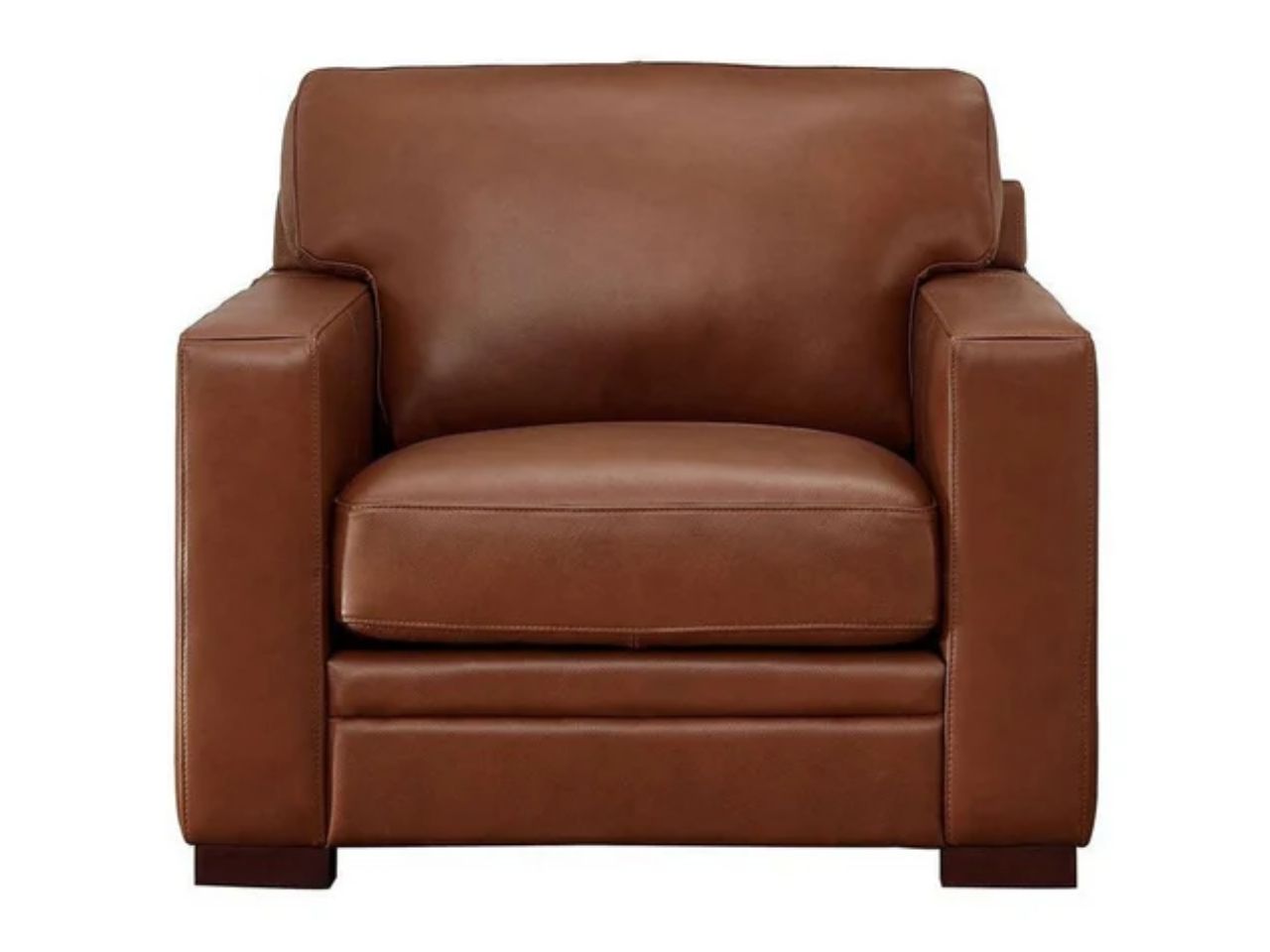 A contemporary leather accent chair featuring clean lines, wide arms, and supportive cushioning, shown in a warm medium brown leather finish on a white background.