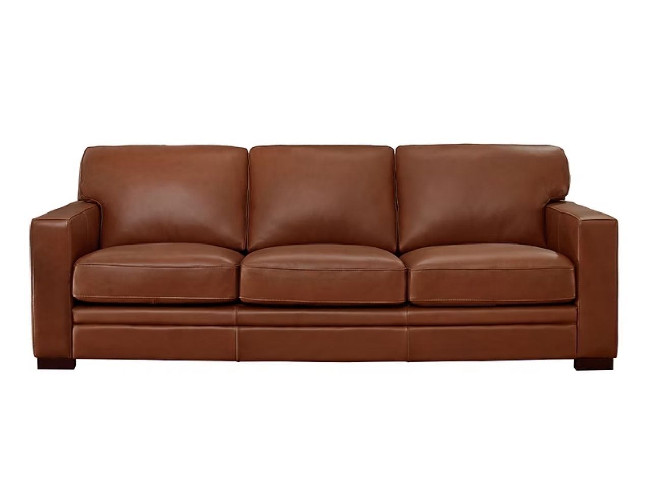 A three-seat leather sofa with a low-profile design, boxy arms, and clean lines, shown in a nutmeg leather finish against a white background.