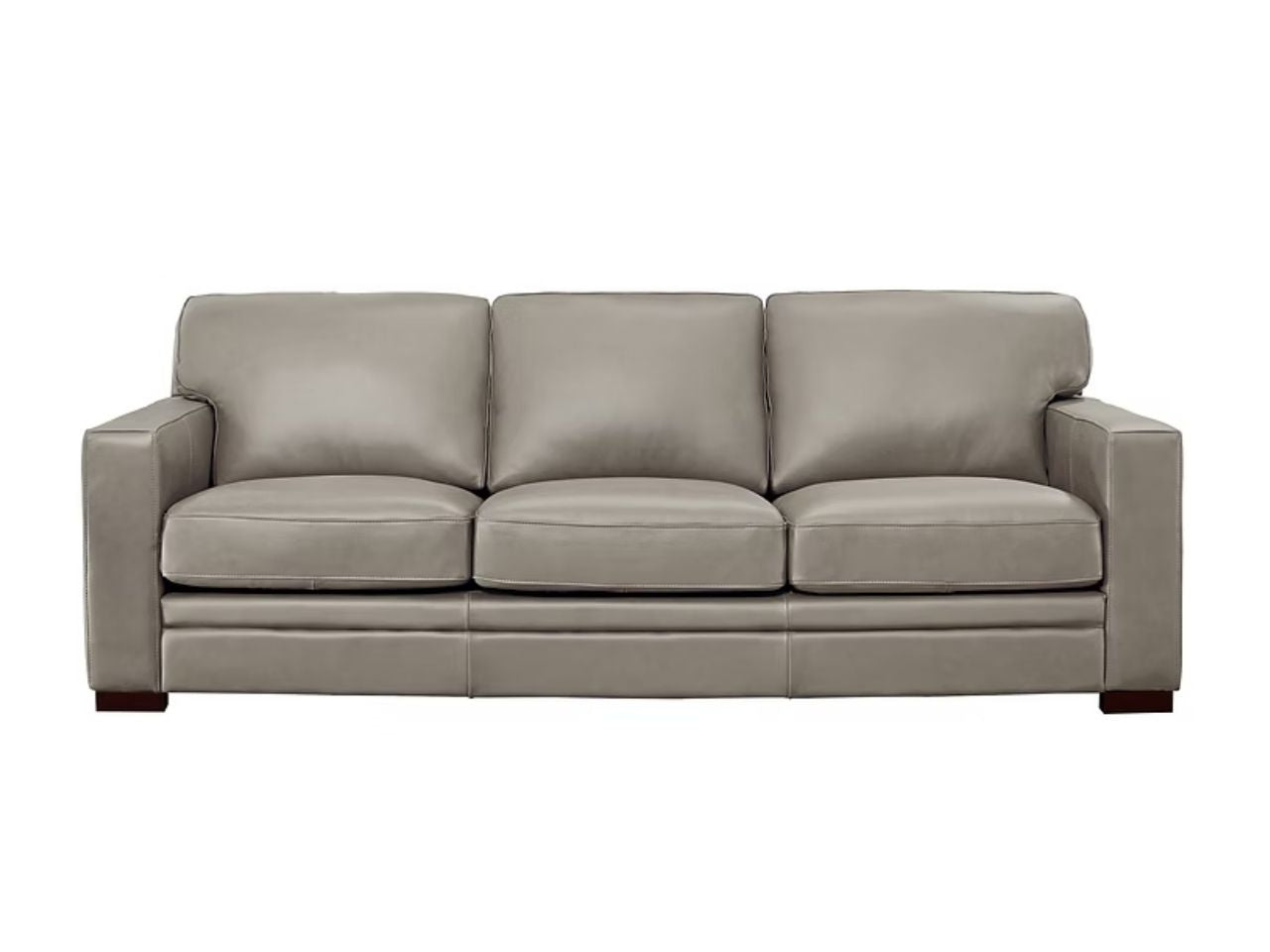 A three-seat leather sofa with a minimalist design, squared arms, and smooth cushions, shown in a stone leather finish against a white background.