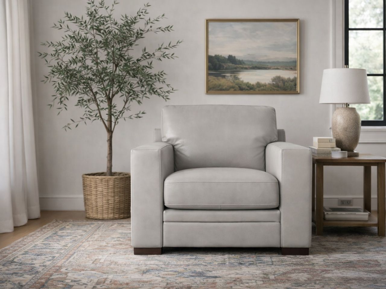 Leather armchair with clean lines, placed in a calm, modern living room.