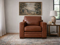 Pecan leather armchair with structured arms and cushioned seat, styled in a bright, elegant living room.