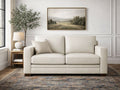 Cream loveseat upholstered in smooth leather or leather-look fabric, styled in a bright, neutral living room.