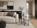 Marble pedestal side table set beside a cream sofa in a modern living room.