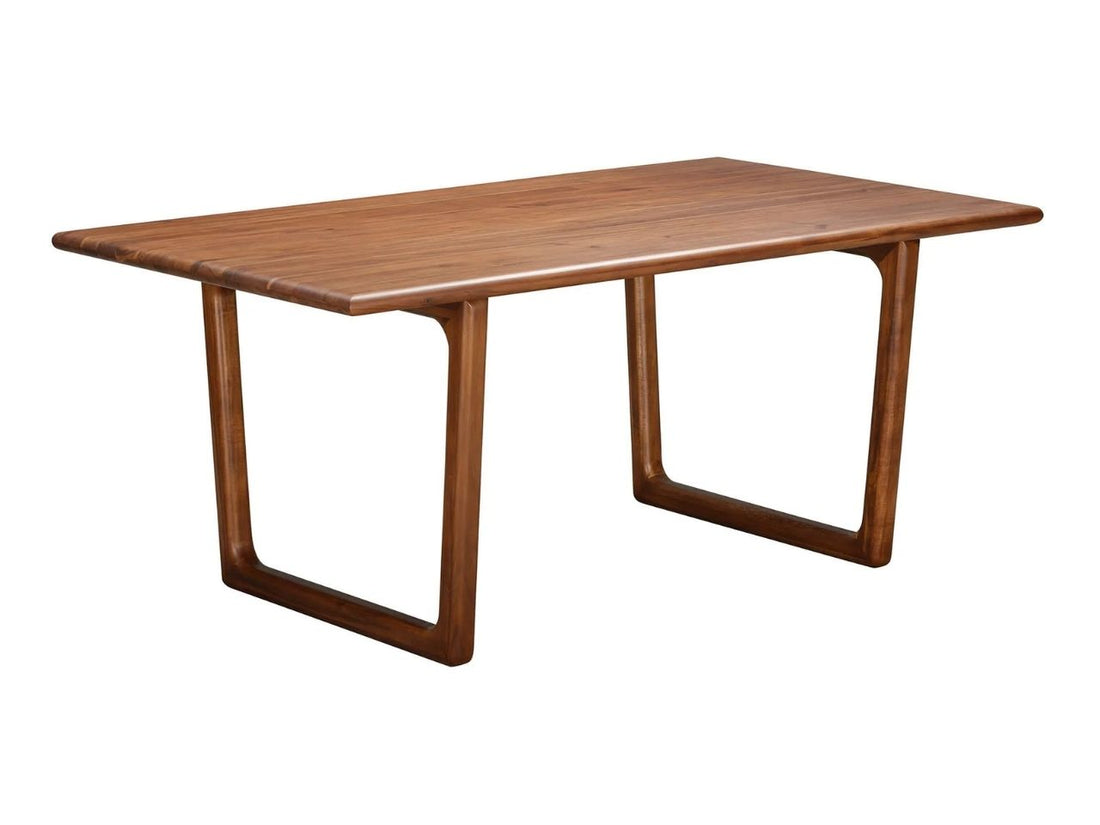 Rectangular wooden dining table with curved legs and chairs in a bright dining room.