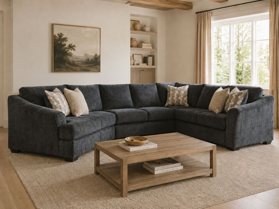 Dark gray sectional sofa in a warm and cozy living room.