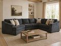 Dark gray sectional sofa in a warm and cozy living room.